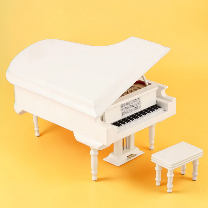 White miniature grand piano model with matching bench