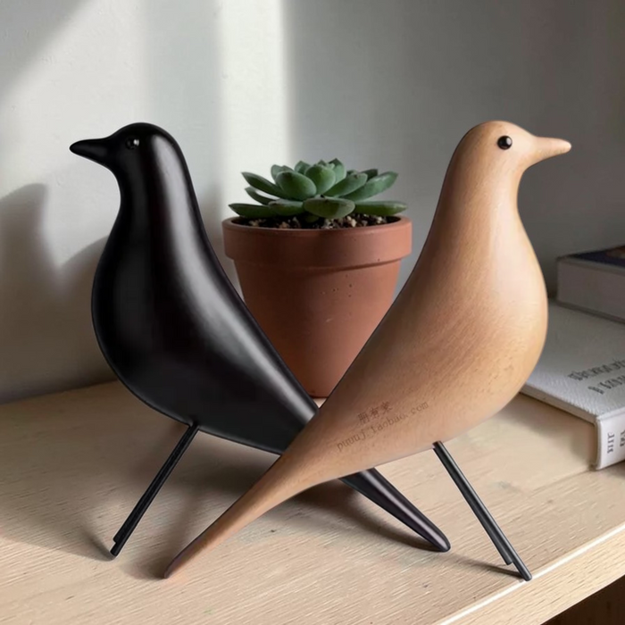 Close-up of black and natural wooden bird shelf ornaments