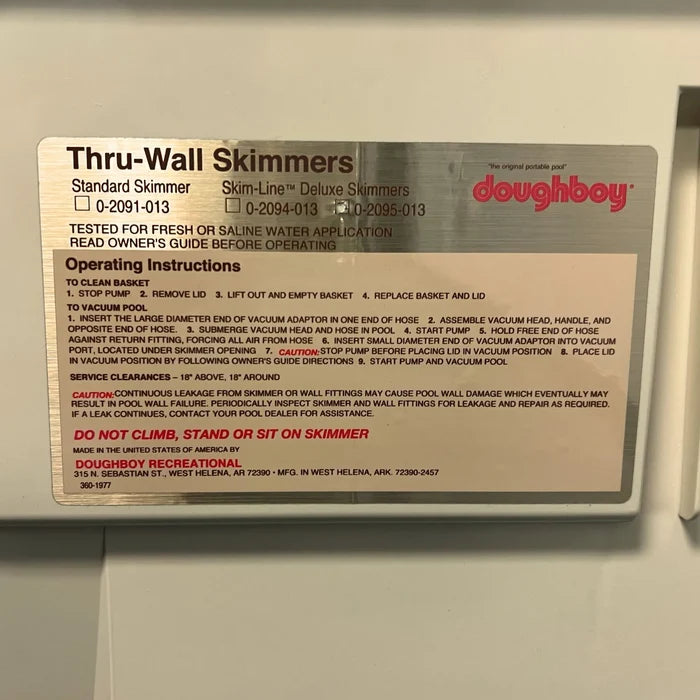Close-up of the Doughboy Thru-Wall Skimmers operating instructions and warning label
