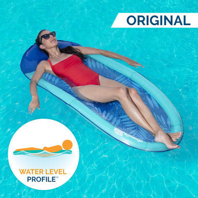 Woman relaxing on a Swimways Spring Float hammock pool lounger featuring Water Level Profile design