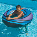 Child playing in a swimming pool with a blue Swimline 40-inch Inflatable Power Blaster Super Squirter swim ring and water gun